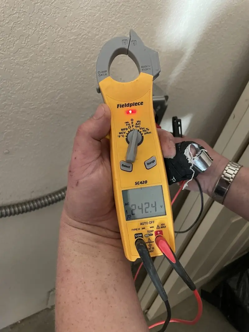Voltage testing with clamp meter during Aluminum Wiring Replacement in Buhl